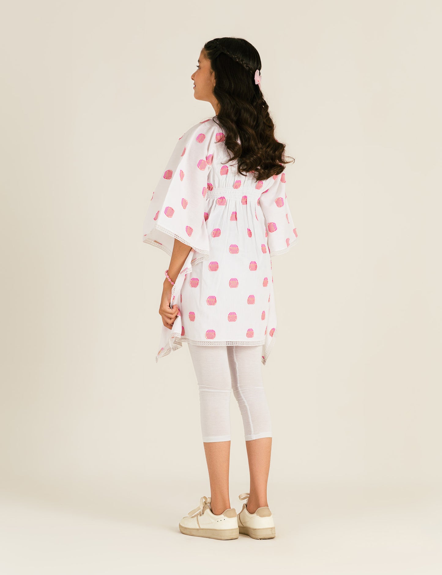 JACQUARD PONCHO WITH SMOCKING DETAIL