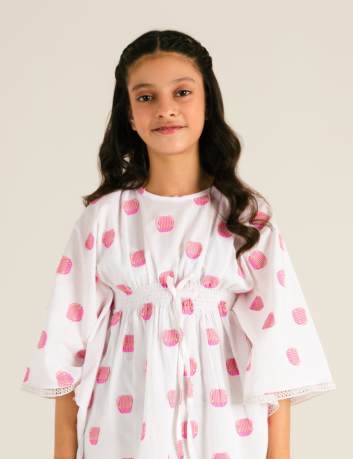 JACQUARD PONCHO WITH SMOCKING DETAIL
