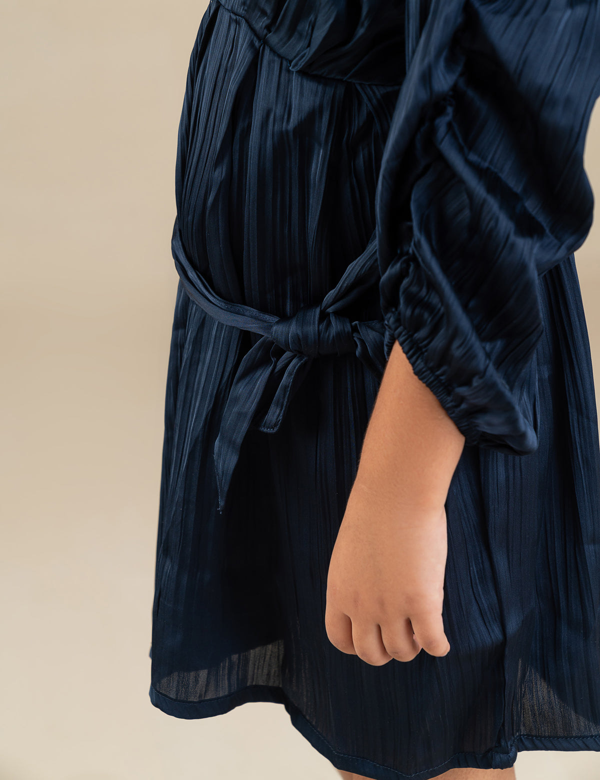 PLEATED BELTED DRESS