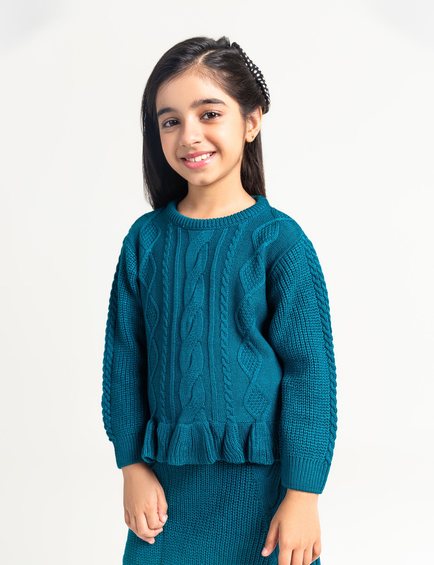 PEPLUM CABLE SWEATER