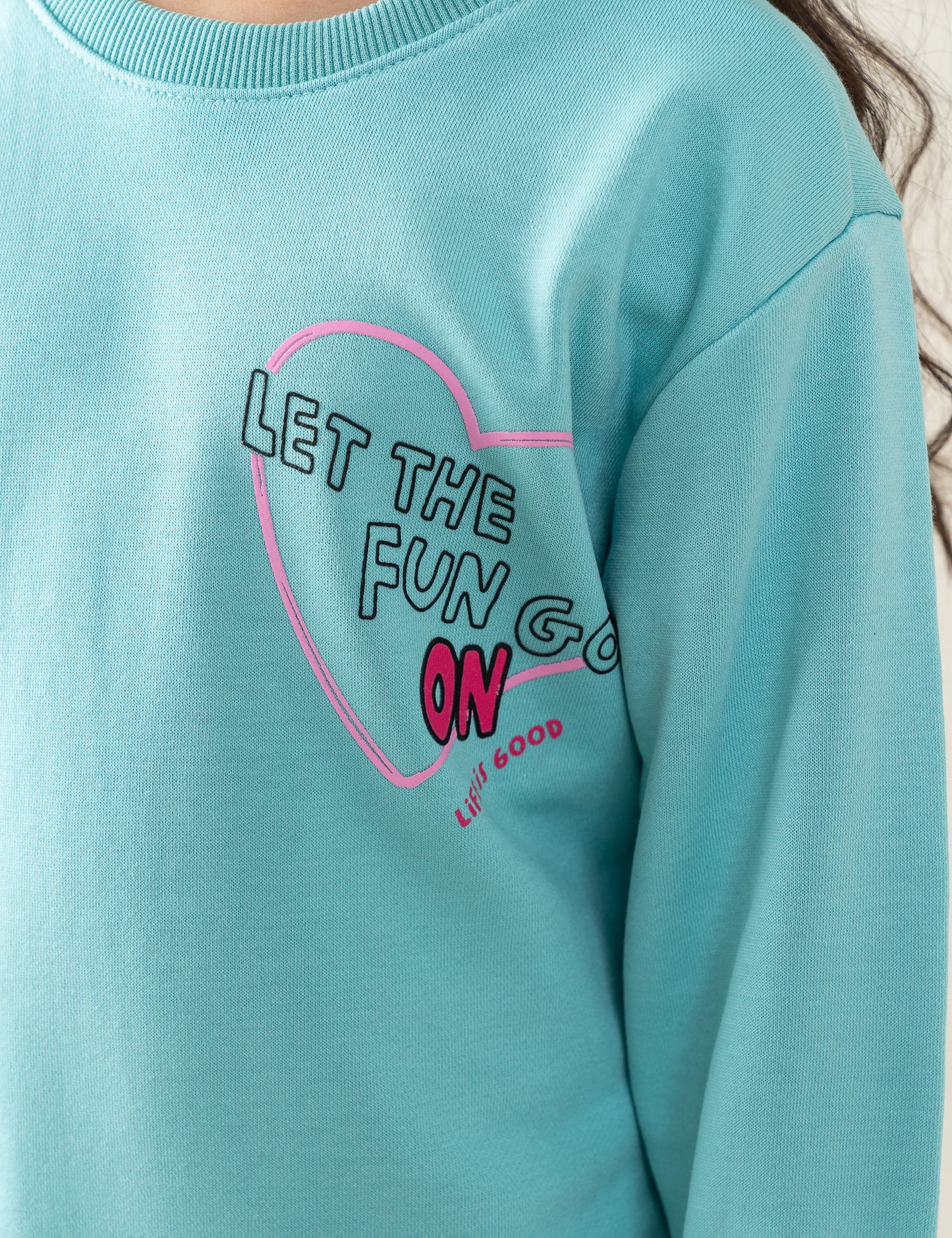 LET THE FUN GO ON PRINTED SWEATSHIRT