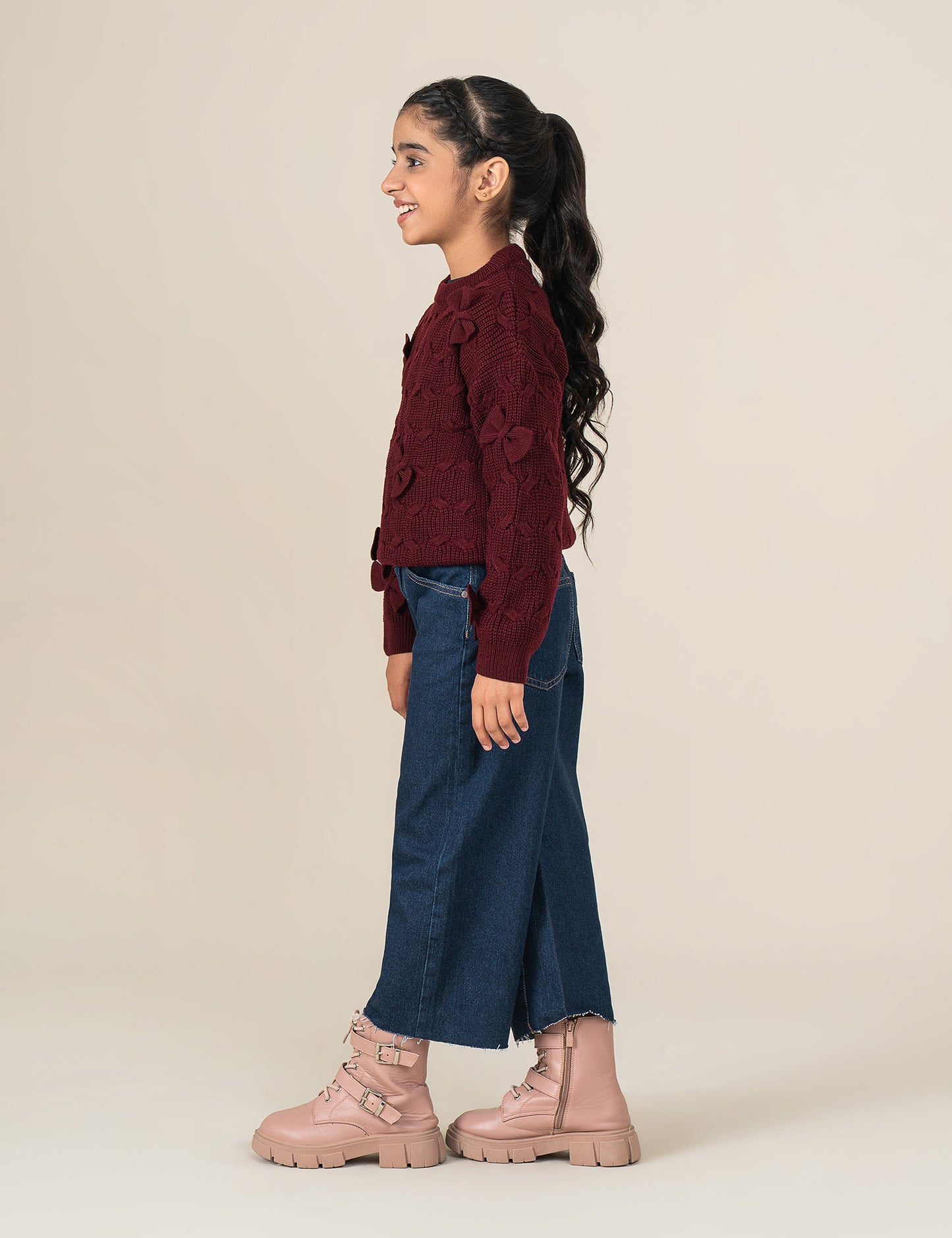 KNITTED SWEATER WITH BOW ACCENTS