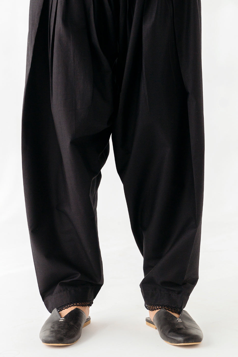 Stylish shalwar featuring intricate lace embellishments.