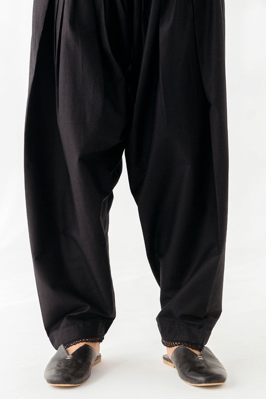 Stylish shalwar featuring intricate lace embellishments.