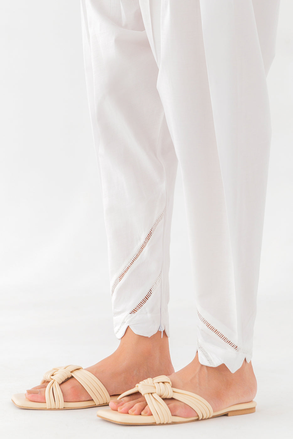 "Slim-cut shalwar with intricate scallop embellishments